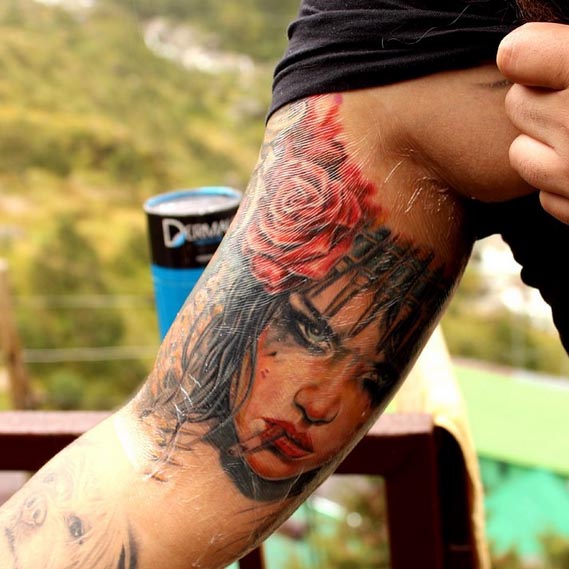 brian viveros with rose color tattoo bicep