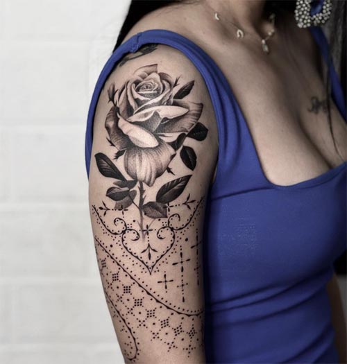 ornamental rose tattoo design woman half sleeve black and grey