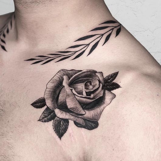 rose petal tattoo design male collarbone