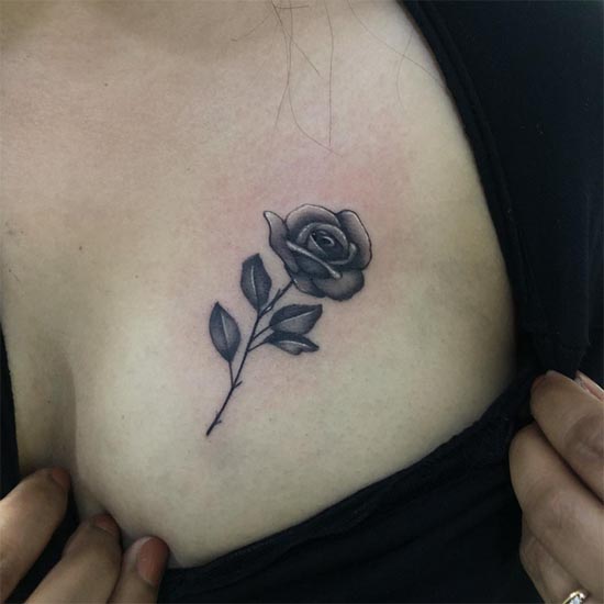 rose small tattoo black and grey female above breast