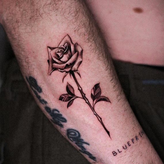 rose tattoo black and grey male hand forearm