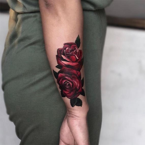 rose tattoo design female forearm black and red