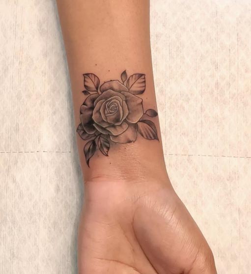 rose tattoo design female lower forearm