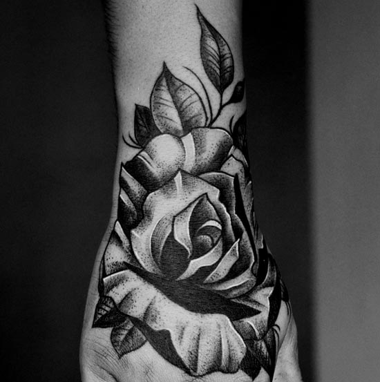 rose tattoo idea hand black and grey