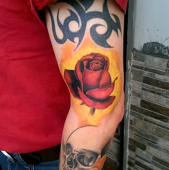 rose tattoo on arm