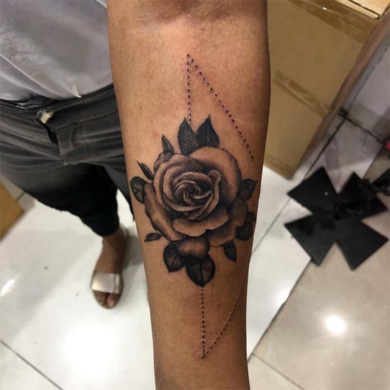 rose with dotted triangle tattoo black and grey female hand forearm