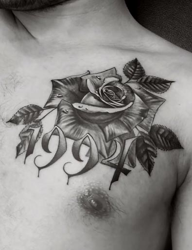rose with leaves tattoo design male chest black and grey