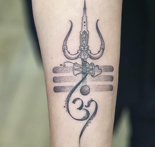 detailed trishul tattoo on Arm