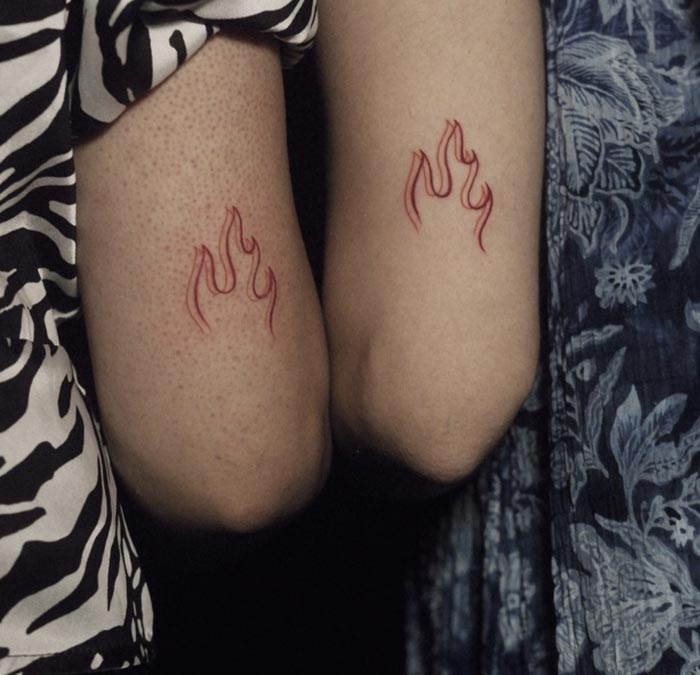 sisters flames twinning tattoo