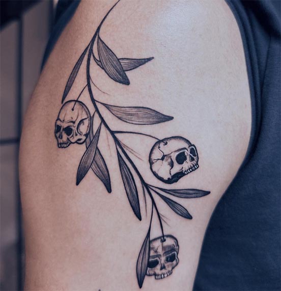 branch-leaves-and-skull-in-place-of-flowers-fruits-tattoo-design-male-bicep