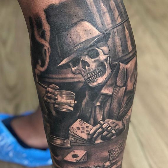gangster skull holding drink cards tattoo design male leg
