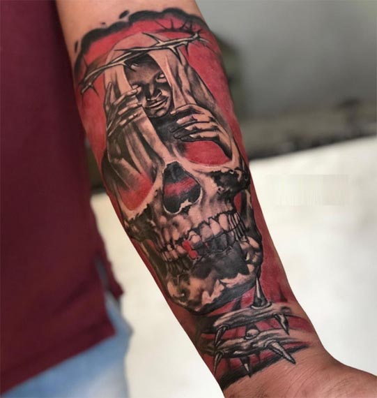 horror skull dark art with man thorny branches black and red tattoo male forearm