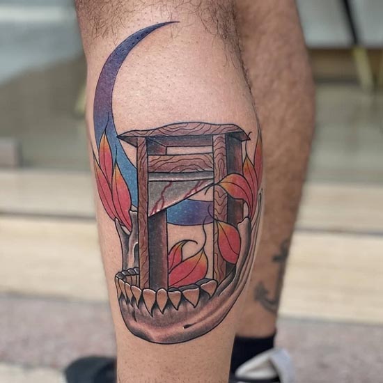 neo traditional color skull jaw moon leaves guillotine tattoo male calf