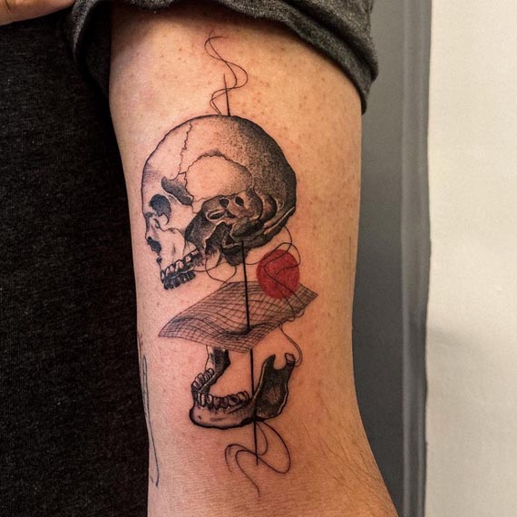 skull apart jaw tattoo abstract geometry stippling male bicep