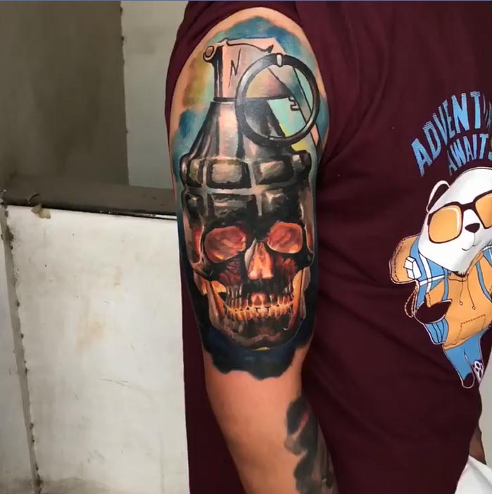 skull grenade tattoo design male hand bicep