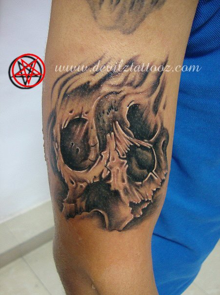 skull tattoo on bicep