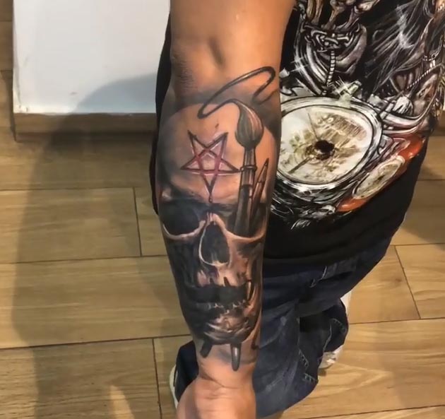 skull with brush star of david tattoo male forearm