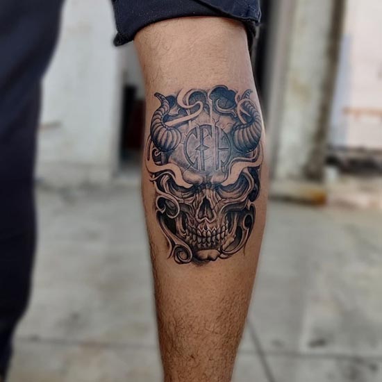skull with horns mask tattoo design male leg calf