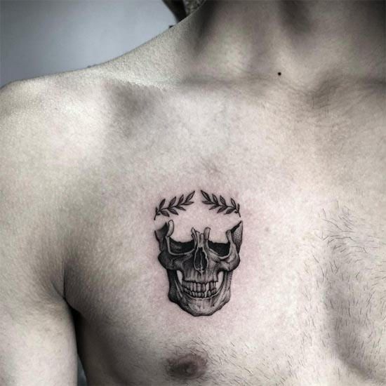 small skull laurel wreath tattoo design male chest