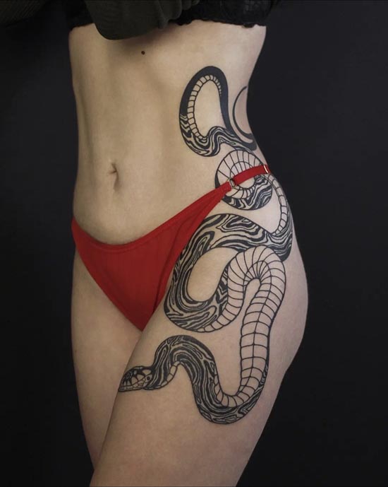 intertwined snake going down female side hip thigh