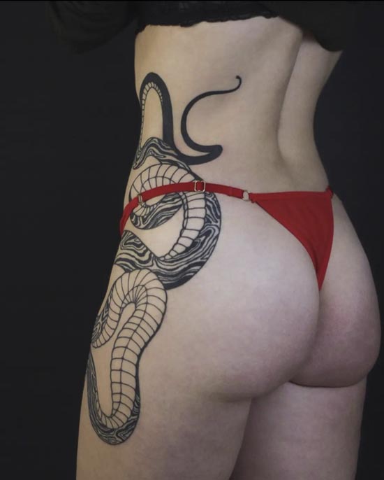 intertwined snake going down female side hip thigh