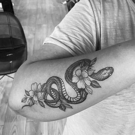 snake cherry blossom tattoo design female hand forearm black and grey