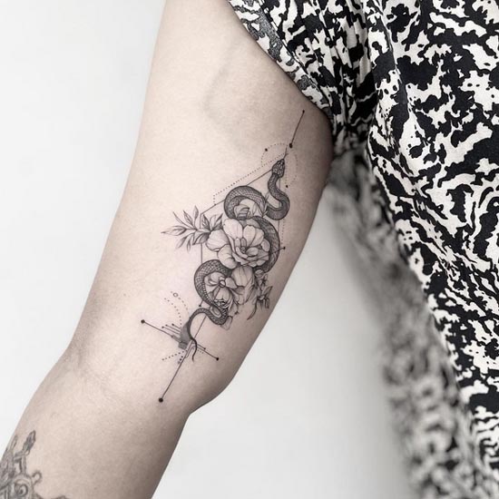 snake flower geometric pattern tattoo fine line female inner bicep