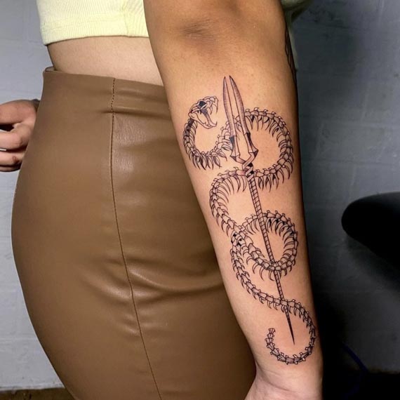 snake skeleton military fork tattoo female arm