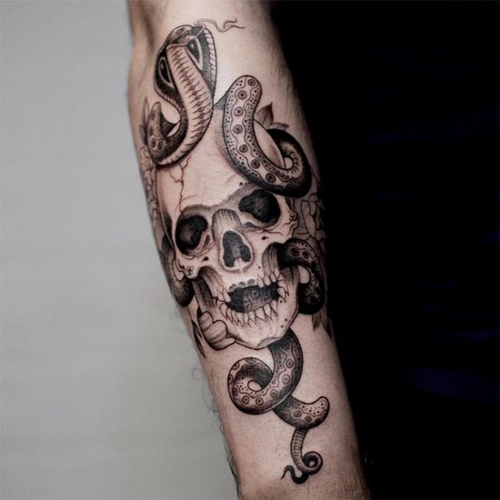 snake skull flowers tattoo design male hand forearm
