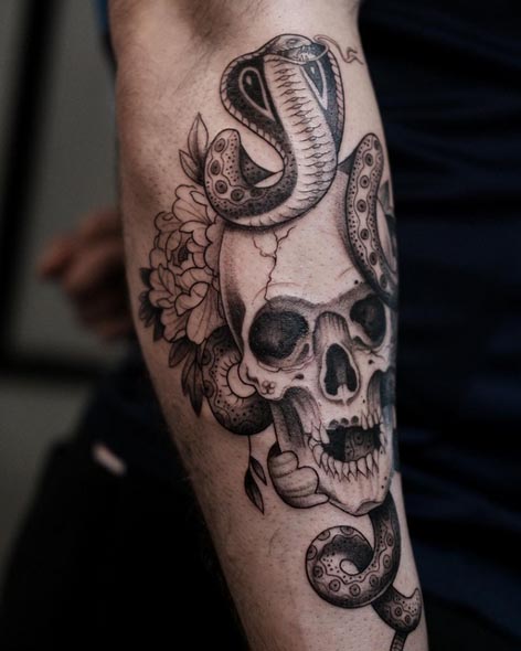 snake skull flowers tattoo design male hand forearm