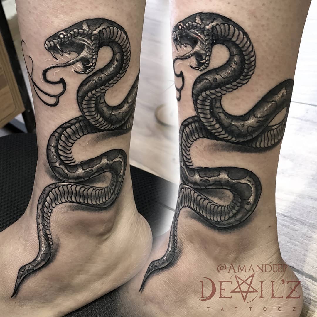 snake tattoo design female leg black and grey