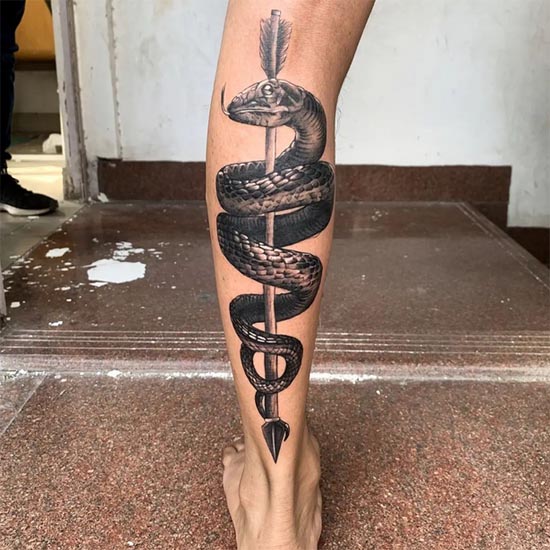 snake wrapped around arrow tattoo design hyperrealism male leg