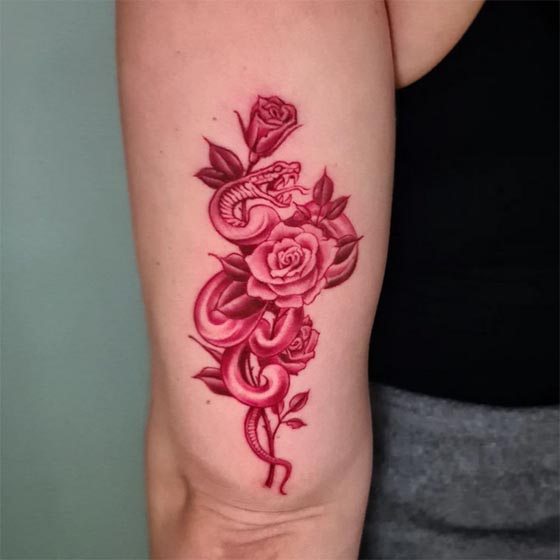 snake wrapped around rose tattoo design color red female outer bicep