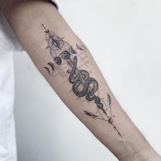 snake wrapped around wooden arrow eye moon phases earth tattoo geometric fine line male forearm