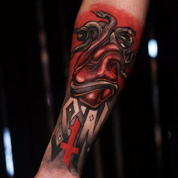 snakes tattoo with human head sin city tattoo design male hand forearm