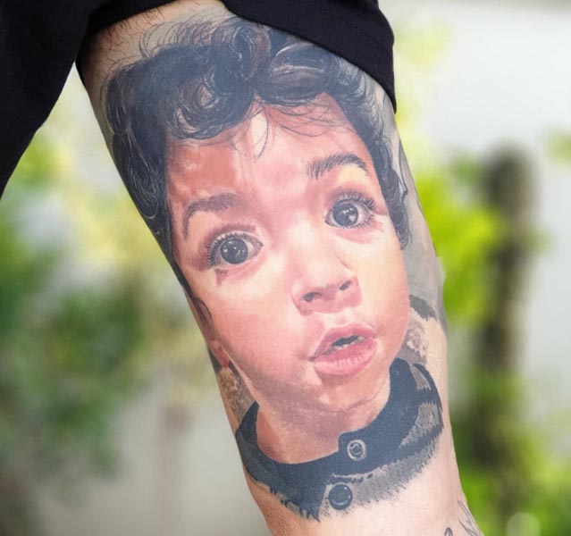 arm father son portrait tattoo