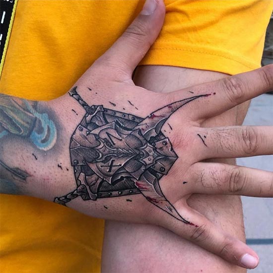 2 swords shield tattoo design idea male hand