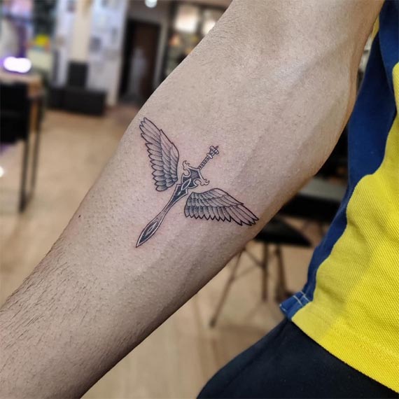 angel wings sword tattoo design male forearm