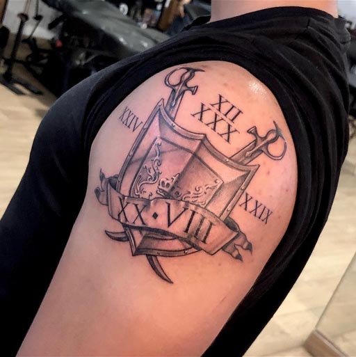 royal sword shield roman numbers tattoo design male arm bicep