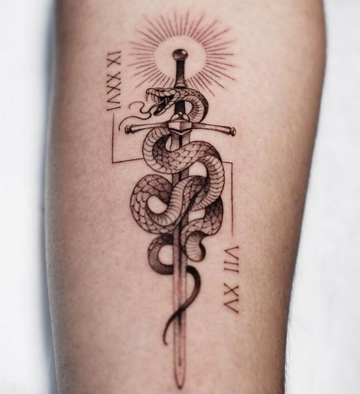 snake wrapped around sword with sun roman number tattoo male forearm