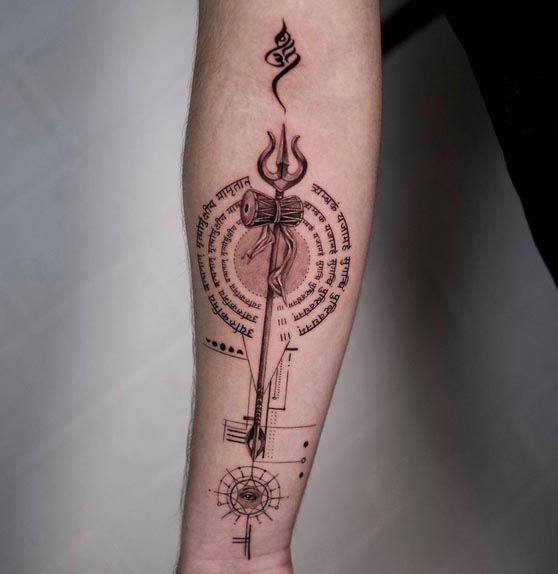 circular mrityunjaya mantra background om trishul damru above it eye top and bottom tattoo male forearm