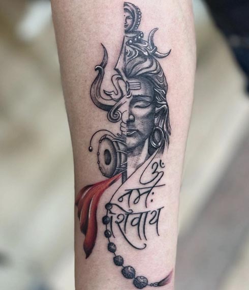 half face shiva shakti half trishul damru below text om namah shivay rudraksh rosary tattoo trishul man forearm