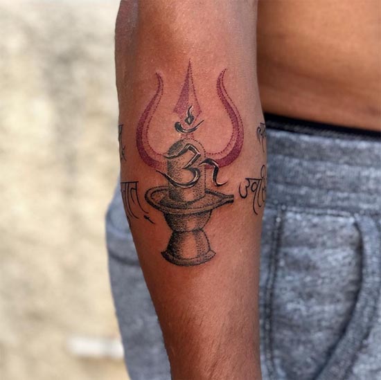 om word on trishul and shiva linga mahamrityunjay mantra band tattoo design male arm 1