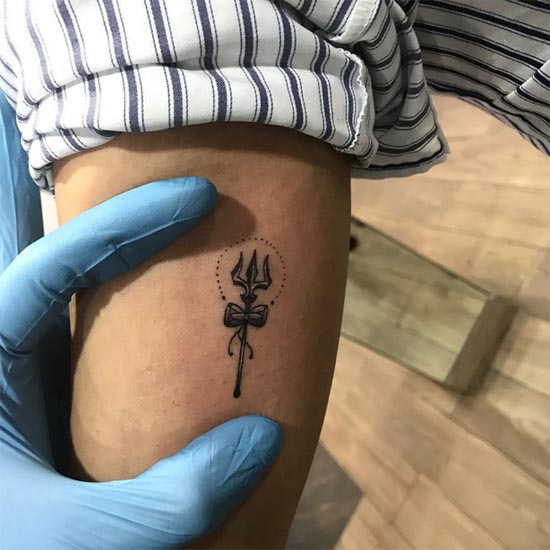 trishul with damru minimalist tattoo design inner bicep