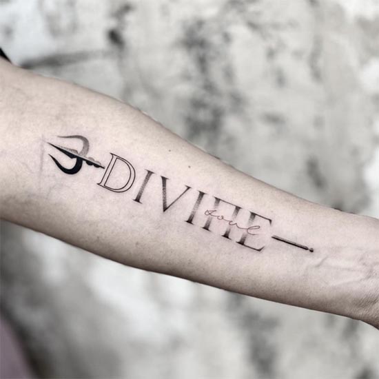 trishul with divine soul word minimalist tattoo male forearm