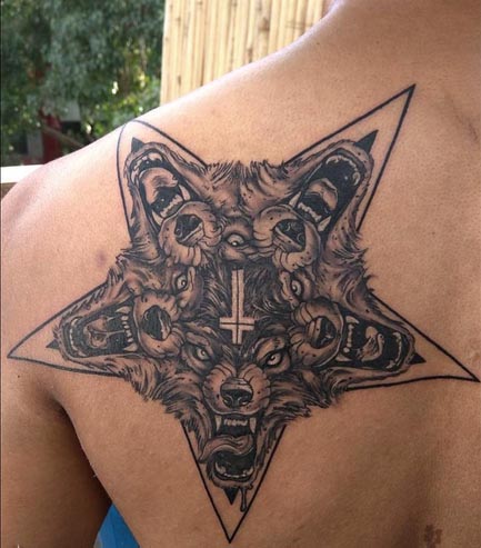 5 angry wolf faces in 5 pointed star tattoo neo traditional new school male back shoulder