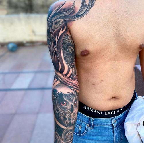 full sleeve animal tattoo owl wolf stag rose male arm 1