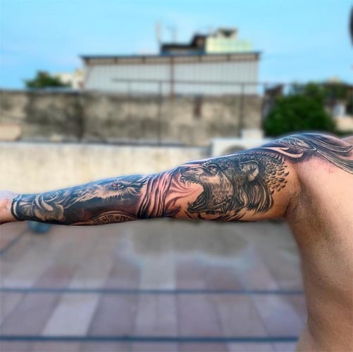 full sleeve animal tattoo owl wolf stag rose male arm 3