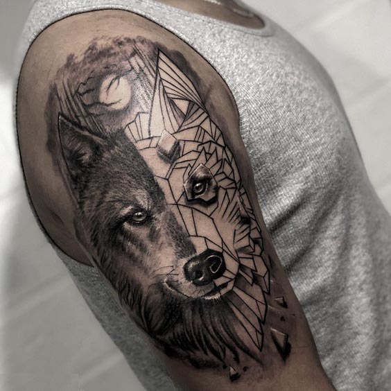 half realistic half geometric wolf head with jungle background tattoo design male bicep