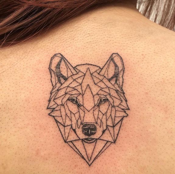 small wolf head geometric linework tattoo design female back